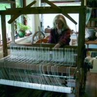 Shirley working on one her large looms